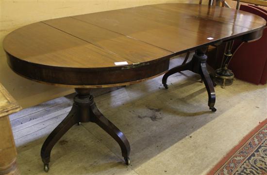 Mahogany extending dining table on 2 tripod supports(-)